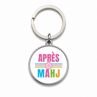 Round Mahjong keychain that says Apres Mahj