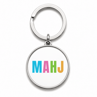 Round Mahjong keychain that says MAHJ in colourful letters