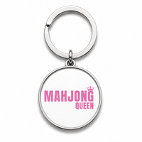 Round Mahjong keychain that says Mahjong Queen in pink