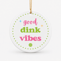 Round ceramic pickleball ornament that says good dink vibes in green