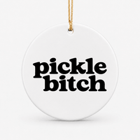 Round ceramic pickleball ornament that says pickle bitch