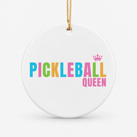 Round ceramic pickleball ornament that says pickleball queen in rainbow colours