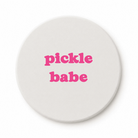 Round ceramic pickleball coaster that says pickle babe in pink