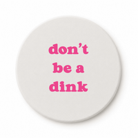 Round ceramic pickleball coaster that says dont be a dink in pink