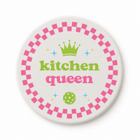 Round ceramic pickleball coaster that says kitchen queen with crown and pink checkered border