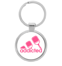 Round pickleball keychain with pink addicted paddle design