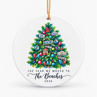 Round white personalized ornament with a colourful Christmas tree and the words The Year We Moved To